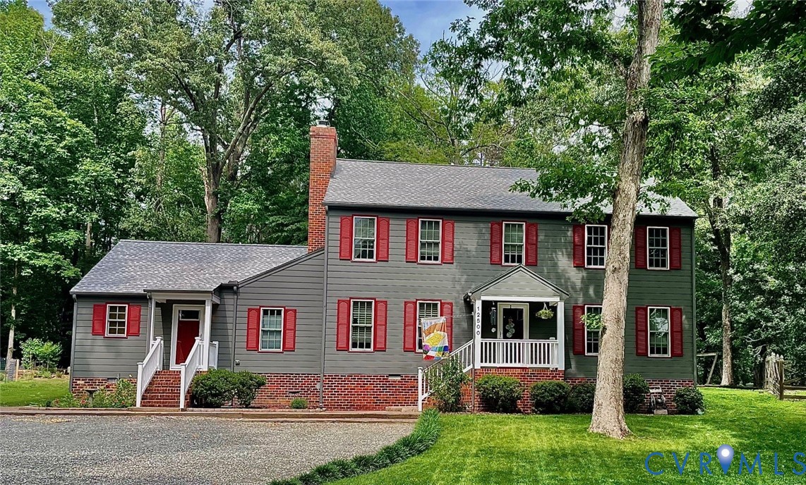 12500 Musical Lane Midlothian, VA 23113 - Photo 2 of 4 Gray siding colonial-style residence featuring red