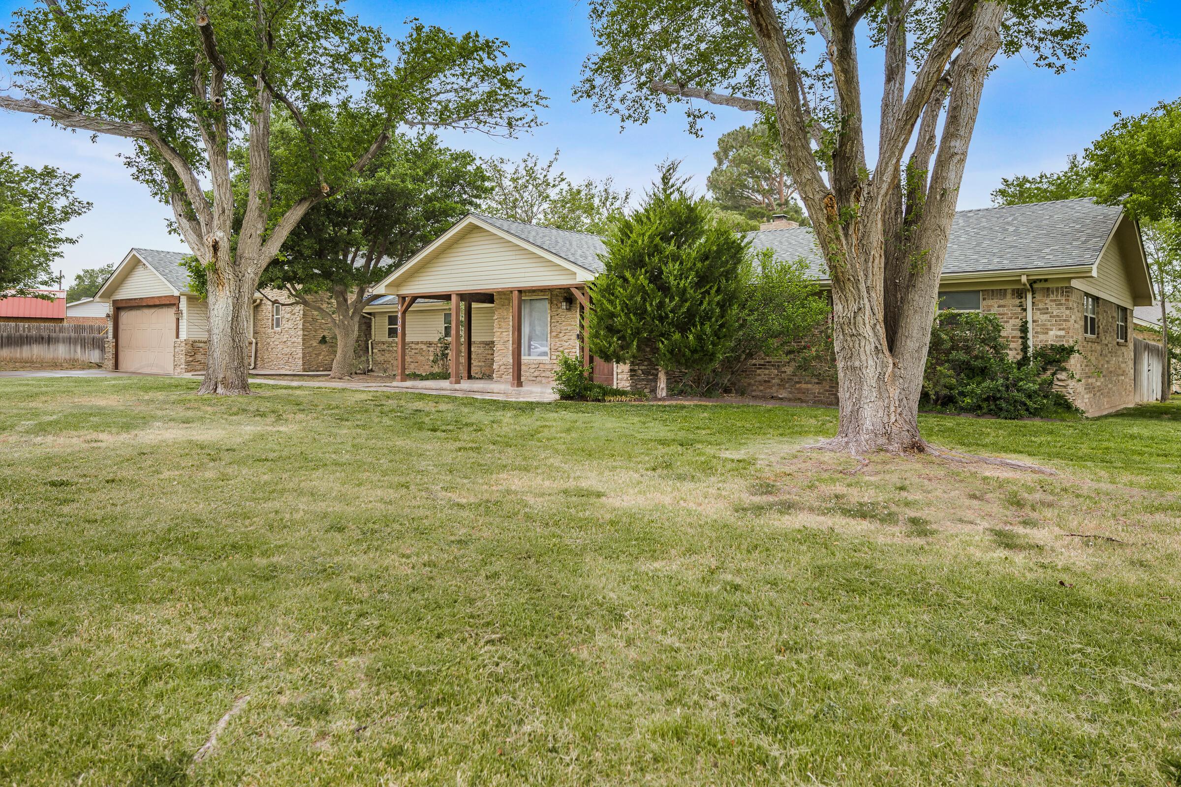 4400 West Farmers Avenue Amarillo, TX 79110 - Photo 2 of 27 front view of a house with a yard