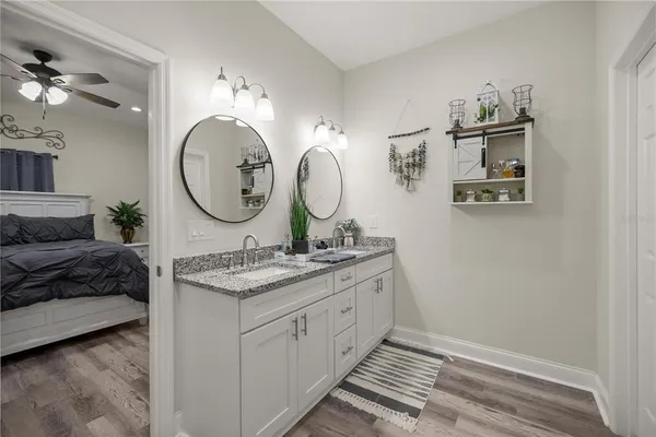 a bathroom with a shower and a glass door