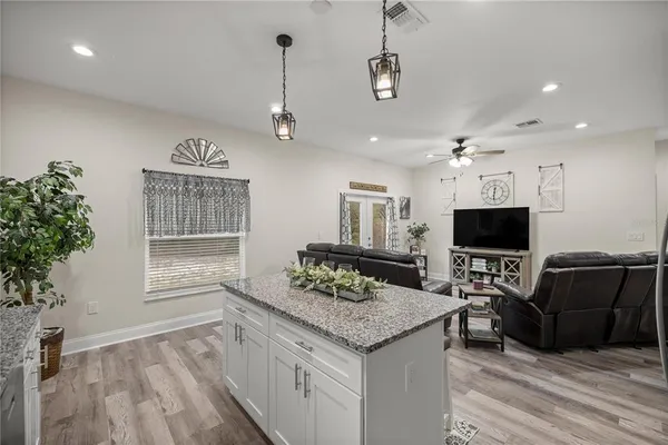 a kitchen with cabinets and stainless steel appliances