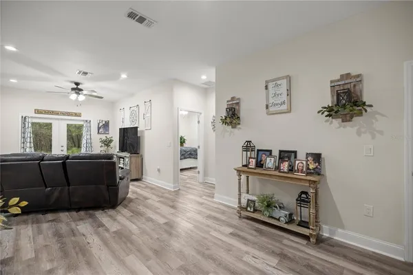 a living room with furniture and a large window