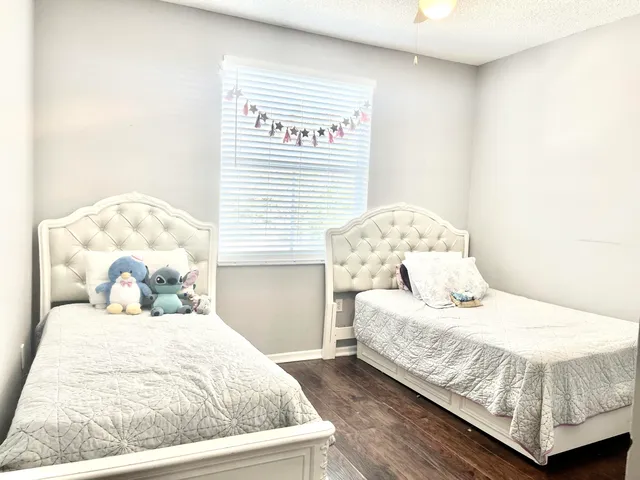 a bedroom with a bed and lamp