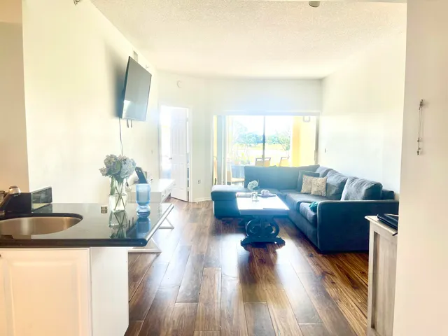 a living room with furniture and a large window
