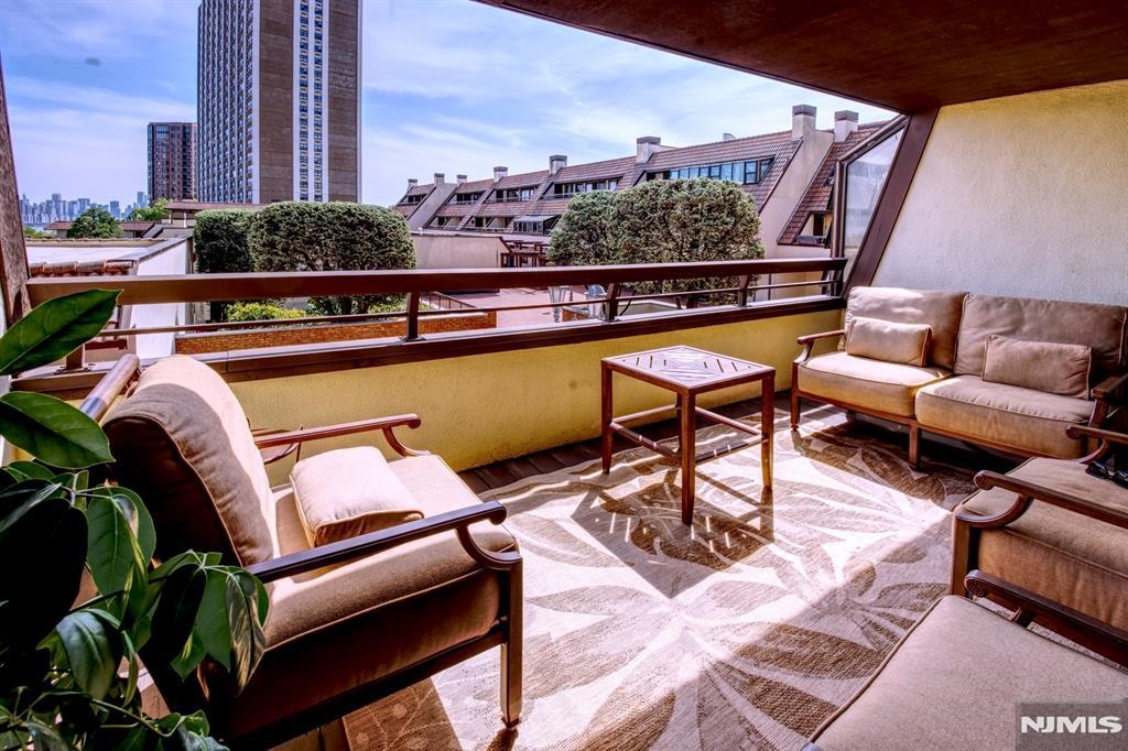 300 Gorge Road, Unit 18 Cliffside Park, NJ 07010 - Photo 13 of 38 a view of a chairs and table in the balcony