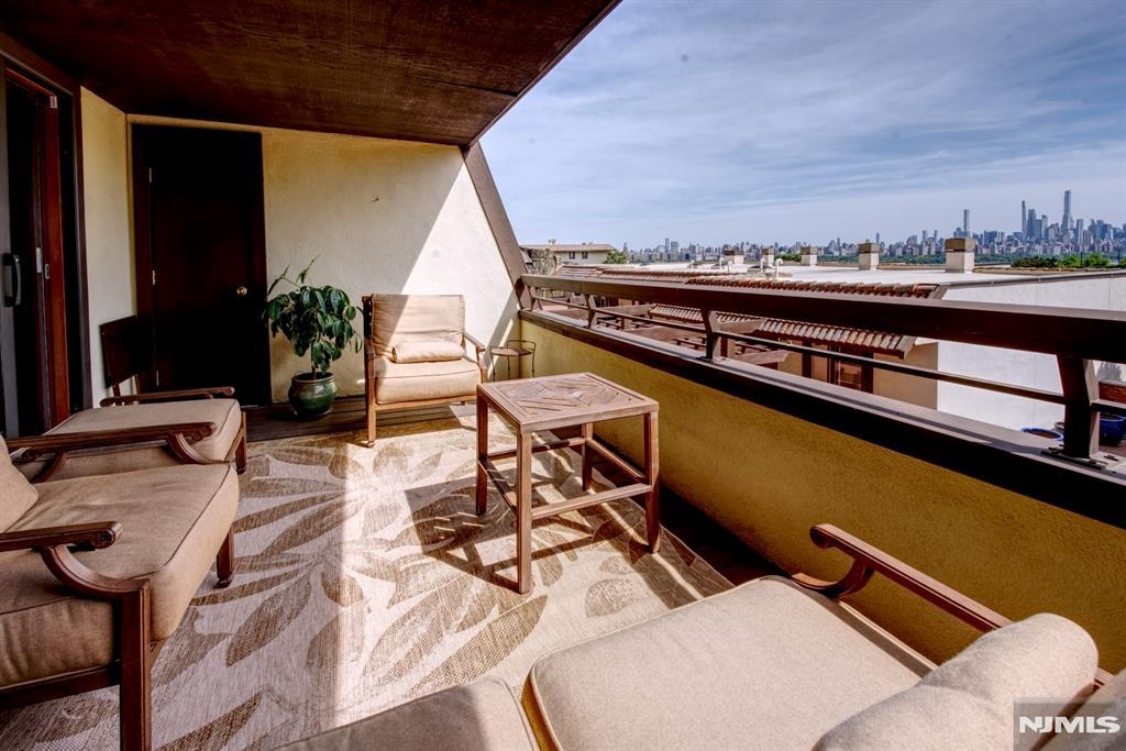 300 Gorge Road, Unit 18 Cliffside Park, NJ 07010 - Photo 14 of 38 a view of a balcony with chairs