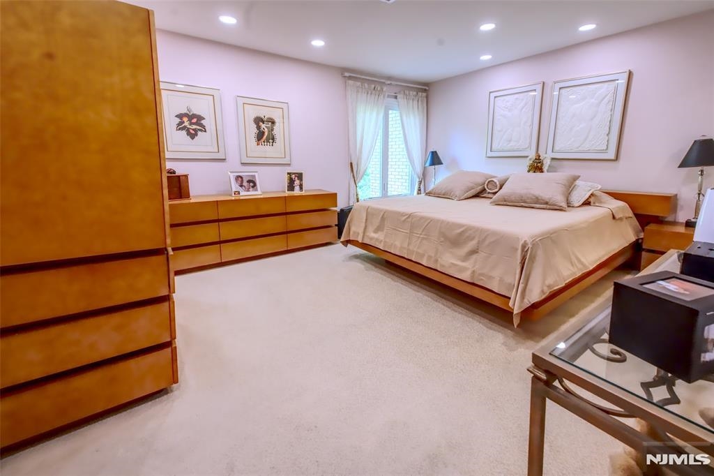 300 Gorge Road, Unit 18 Cliffside Park, NJ 07010 - Photo 19 of 38 a bedroom with a bed and a dresser
