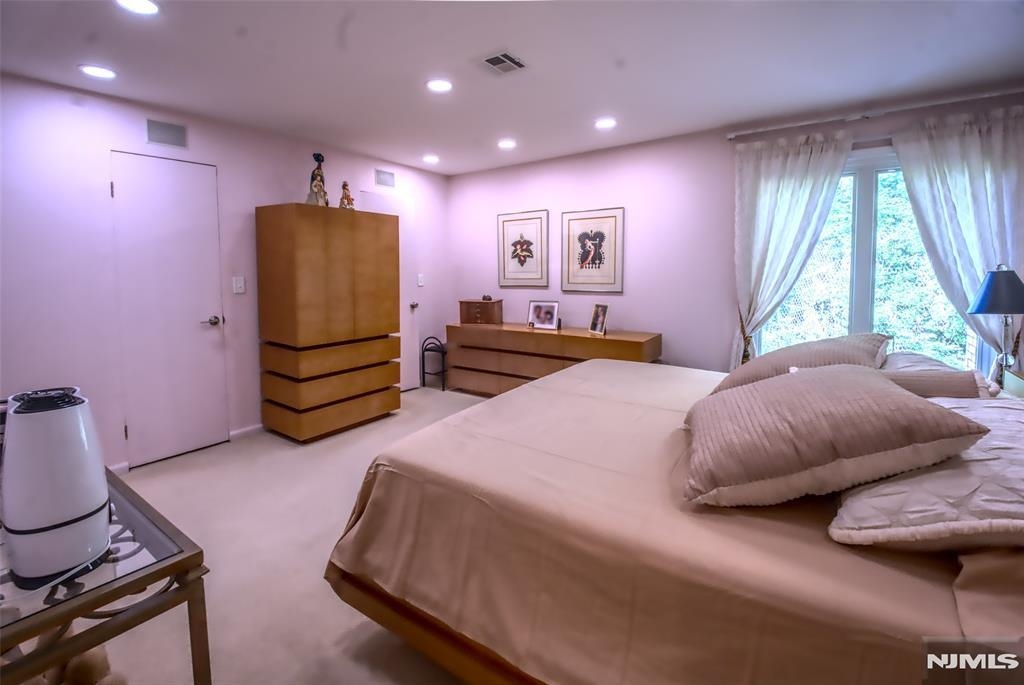 300 Gorge Road, Unit 18 Cliffside Park, NJ 07010 - Photo 21 of 38 a bedroom with bed and window