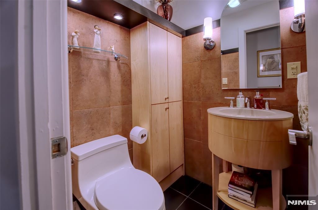 300 Gorge Road, Unit 18 Cliffside Park, NJ 07010 - Photo 26 of 38 a bathroom with a sink toilet and shower
