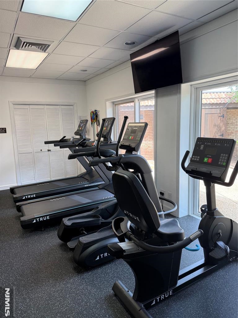 300 Gorge Road, Unit 18 Cliffside Park, NJ 07010 - Photo 31 of 38 a room with gym equipment and a flat screen tv