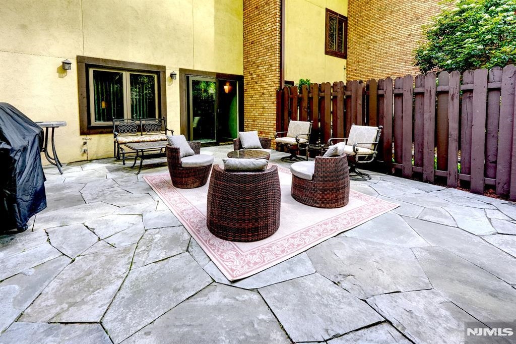 300 Gorge Road, Unit 18 Cliffside Park, NJ 07010 - Photo 33 of 38 a view of a patio with chairs and potted plants