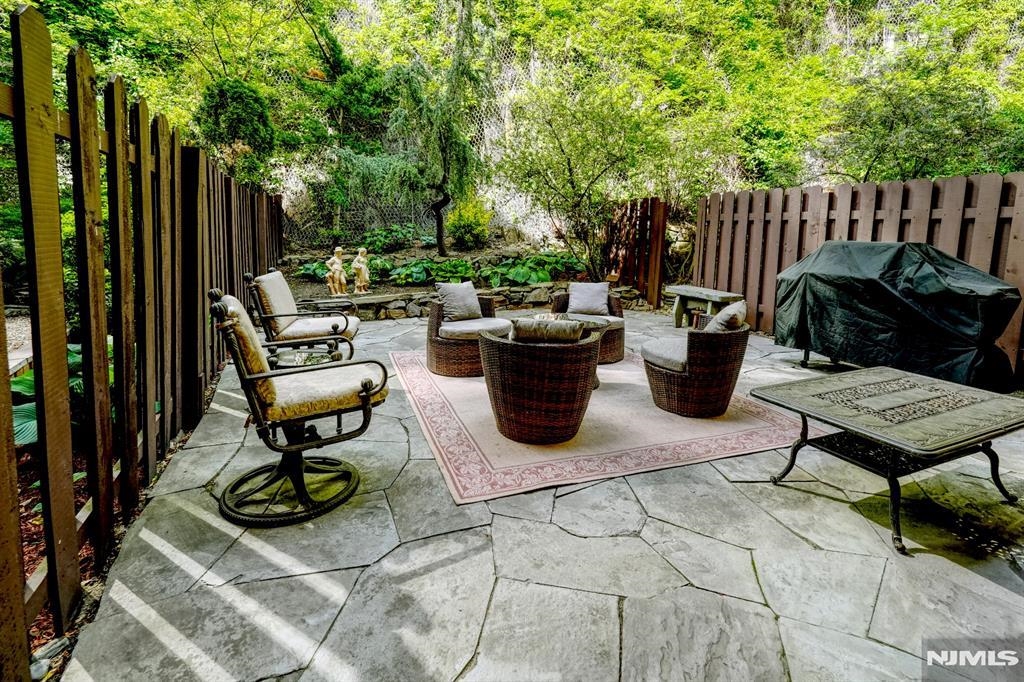 300 Gorge Road, Unit 18 Cliffside Park, NJ 07010 - Photo 34 of 38 a view of a backyard with sitting area