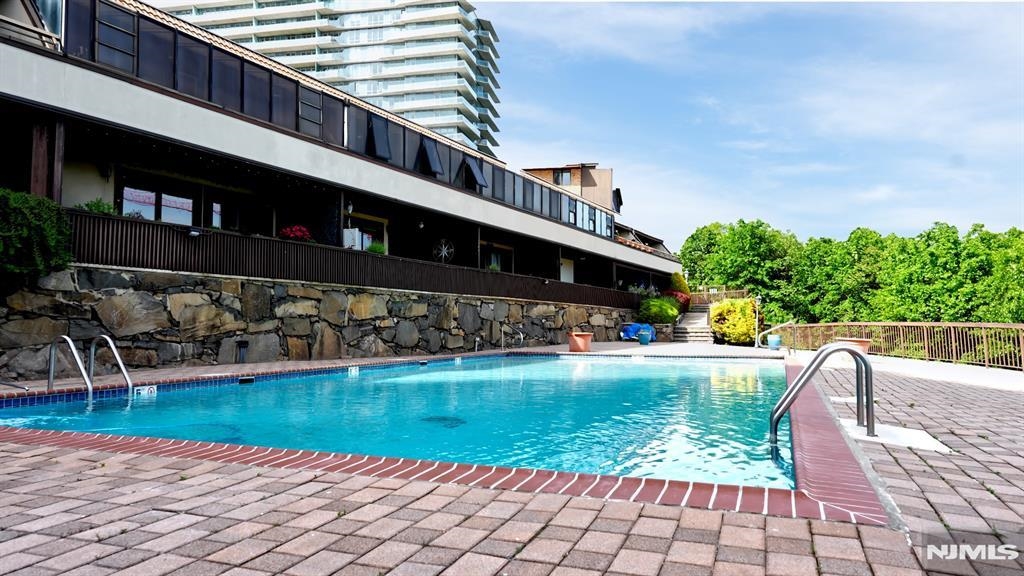 300 Gorge Road, Unit 18 Cliffside Park, NJ 07010 - Photo 38 of 38 a view of a swimming pool with a patio