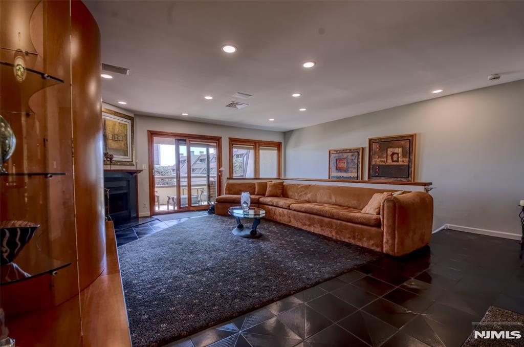 300 Gorge Road, Unit 18 Cliffside Park, NJ 07010 - Photo 6 of 38 a living room with furniture and a wooden floor