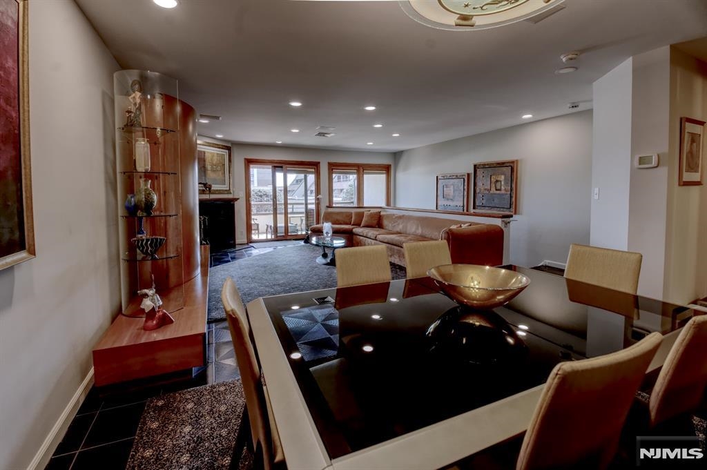 300 Gorge Road, Unit 18 Cliffside Park, NJ 07010 - Photo 7 of 38 a living room with furniture and a fireplace