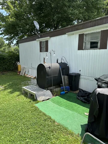 a backyard of a house with seating space