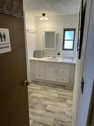 a bathroom with double vanity sink and mirror