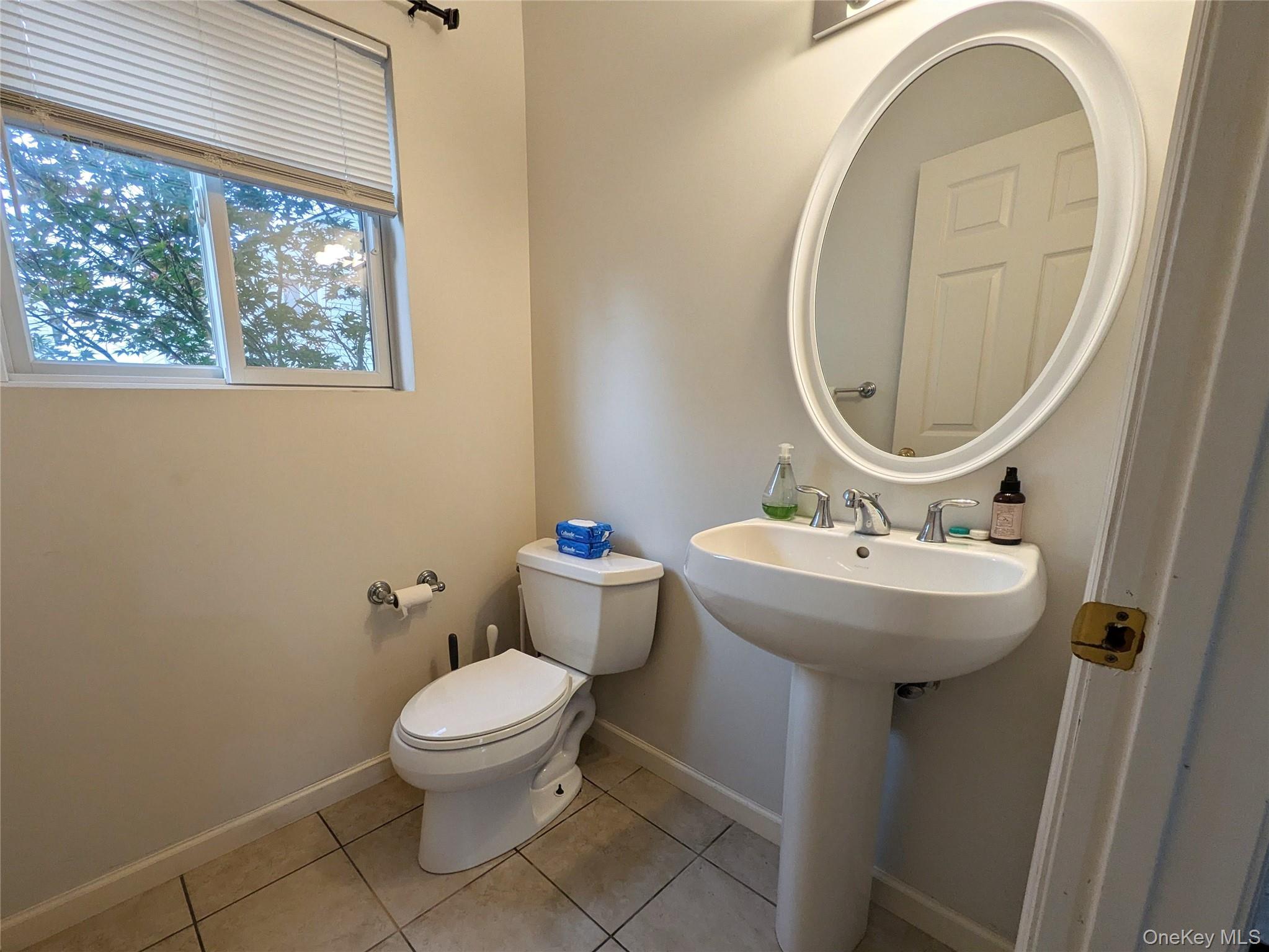 1206 Eagles Ridge Road Brewster, NY 10509 - Photo 11 of 29 Half bathroom with light tile patterned floors and toilet