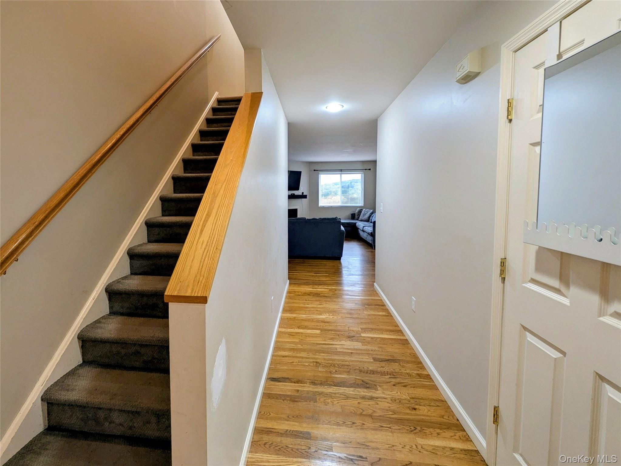 1206 Eagles Ridge Road Brewster, NY 10509 - Photo 12 of 29 Stairway featuring wood finished floors and baseboards