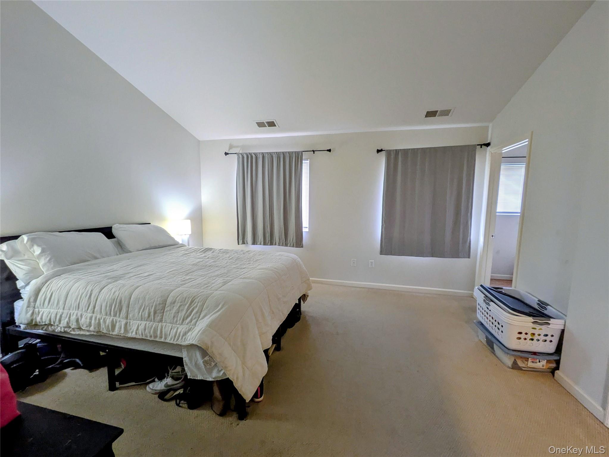 1206 Eagles Ridge Road Brewster, NY 10509 - Photo 13 of 29 Carpeted bedroom featuring baseboards and lofted ceiling