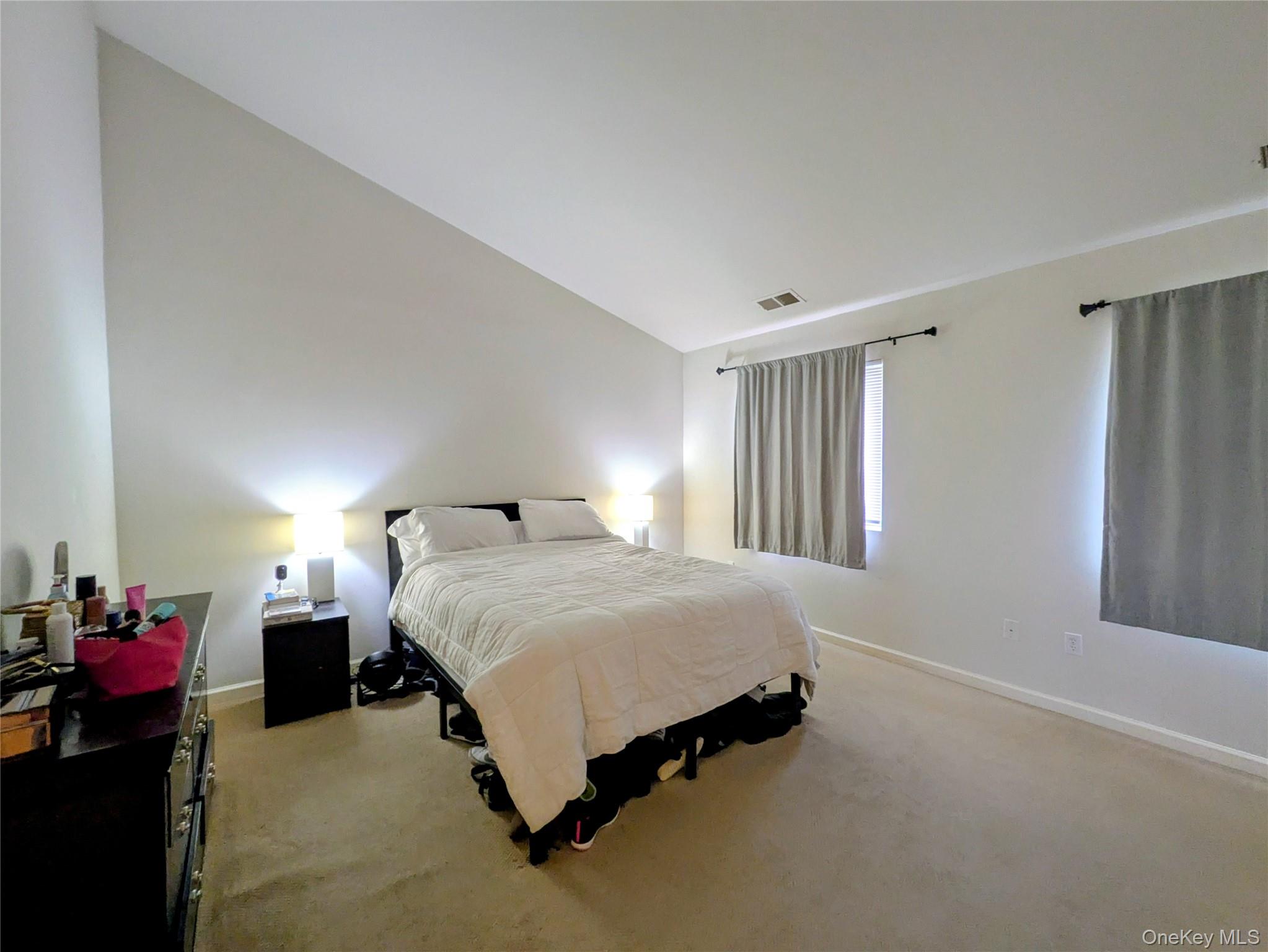 1206 Eagles Ridge Road Brewster, NY 10509 - Photo 14 of 29 Carpeted bedroom featuring baseboards and vaulted ceiling