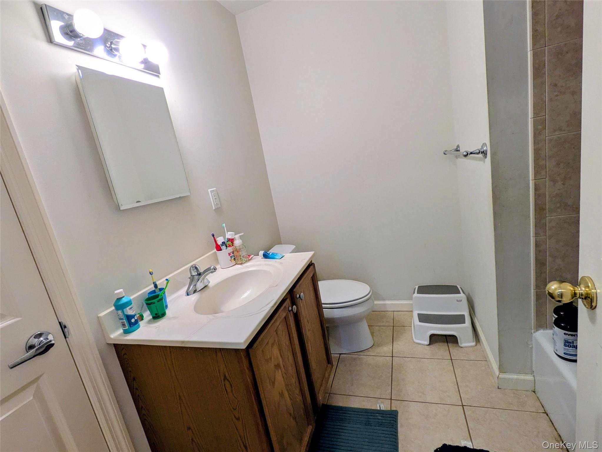 1206 Eagles Ridge Road Brewster, NY 10509 - Photo 20 of 29 Full bath with light tile patterned flooring, vanity, and shower / tub combination