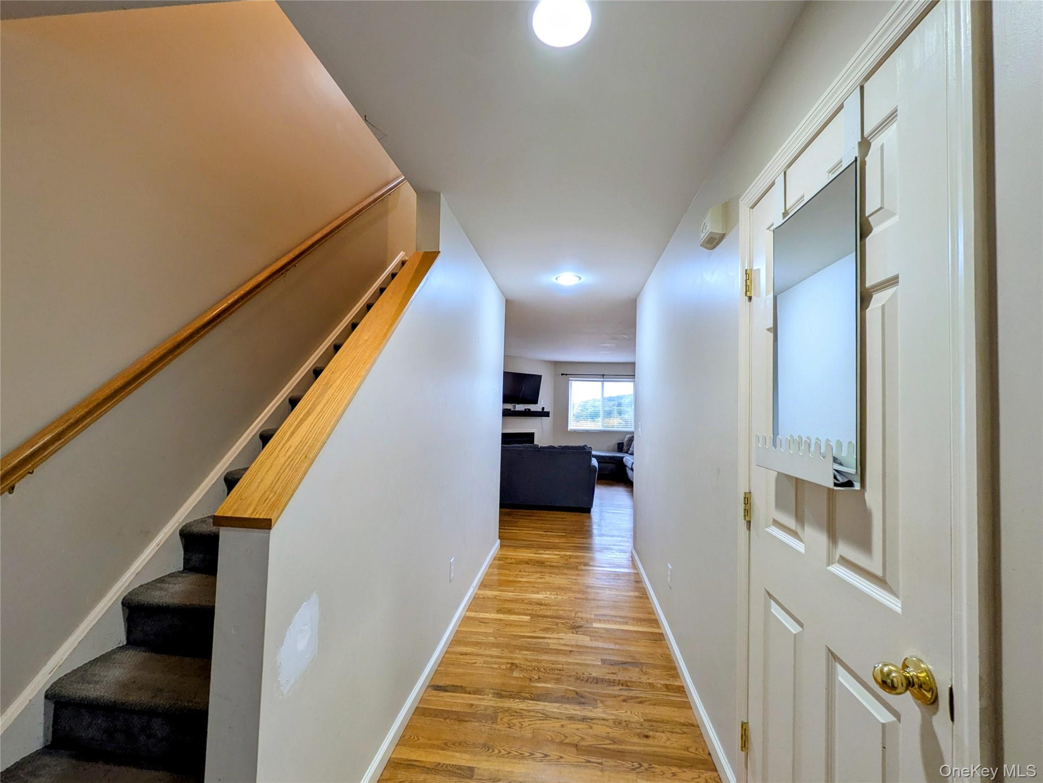 1206 Eagles Ridge Road Brewster, NY 10509 - Photo 2 of 29 Hall featuring light wood-style floors, stairs, and recessed lighting