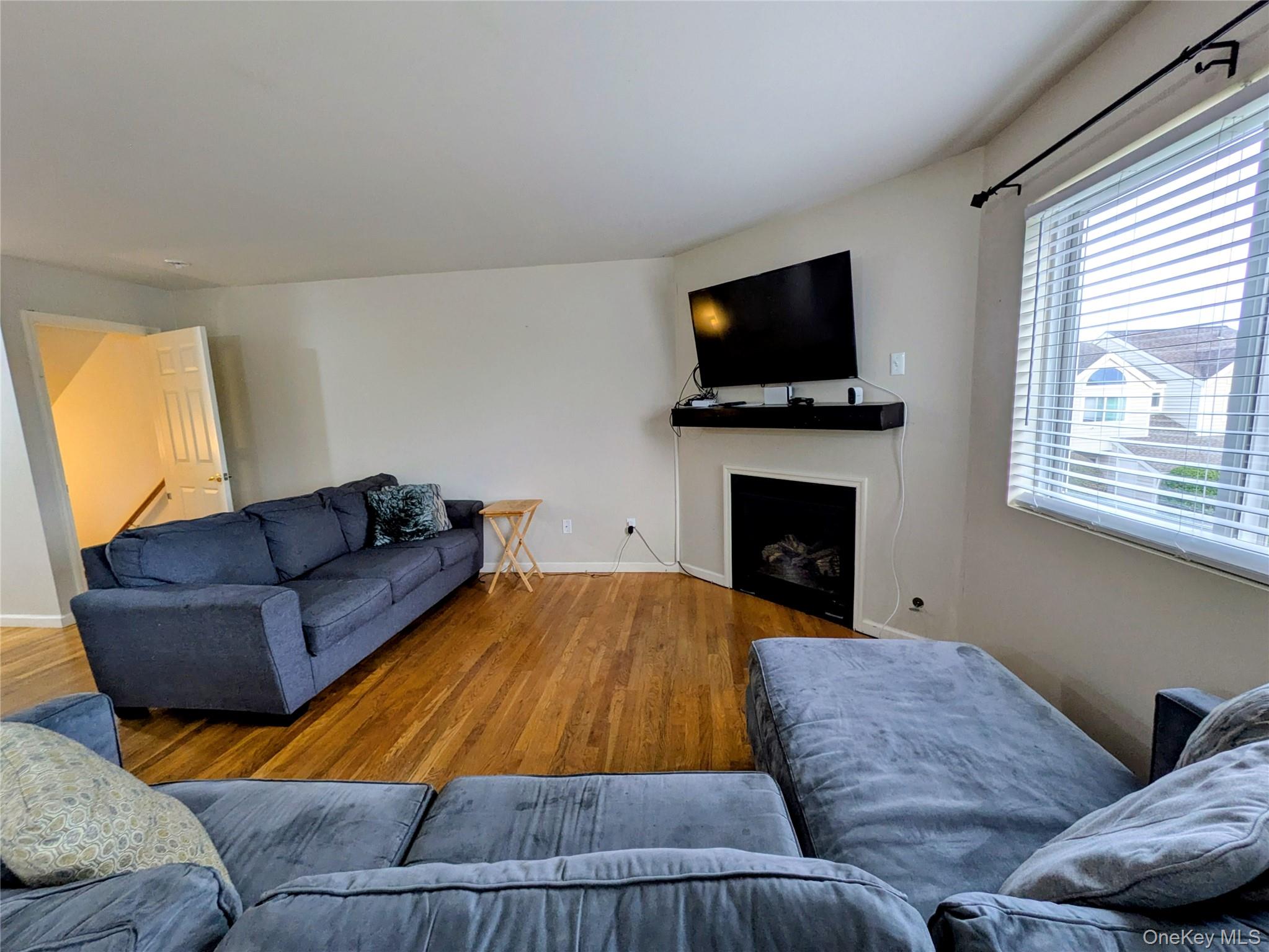 1206 Eagles Ridge Road Brewster, NY 10509 - Photo 8 of 29 Living room featuring a fireplace and wood finished floors