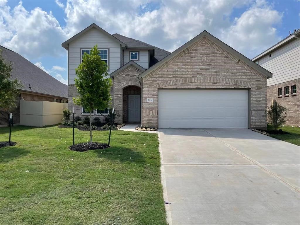 815 Summer Village Way Rosenberg, TX 77469 - Photo 1 of 21 a front view of a house with a yard and chairs