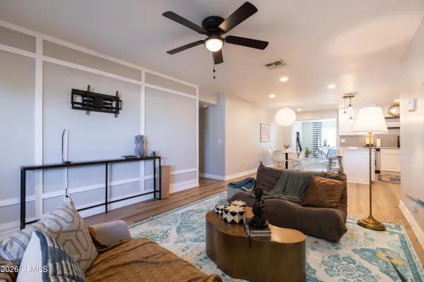a living room with furniture and a potted plant