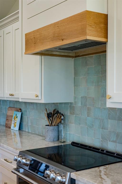 1132 Old Crawford Road Crawford, TX 76638 - Photo 11 of 40 a kitchen with a stove and cabinets