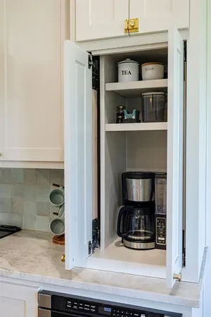 a kitchen with a stove and cabinets
