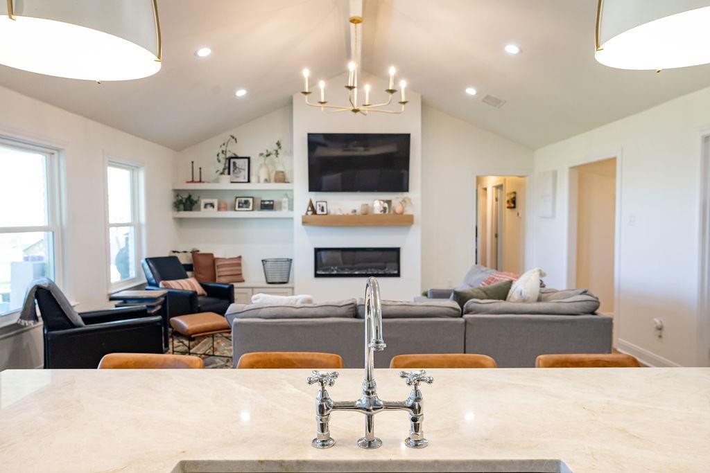 1132 Old Crawford Road Crawford, TX 76638 - Photo 15 of 40 a living room with fireplace furniture and a flat screen tv