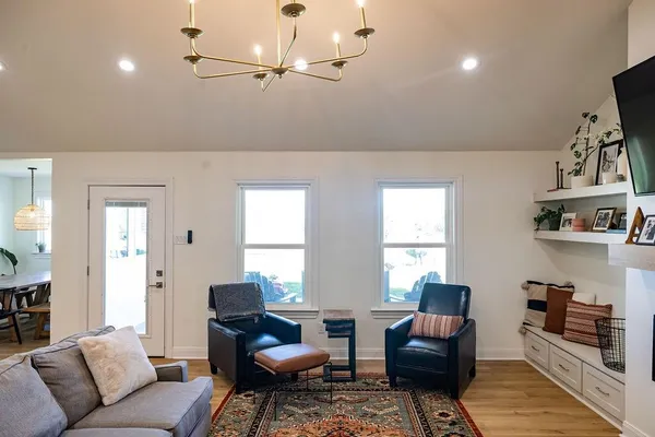 a kitchen with a stove a sink and a refrigerator