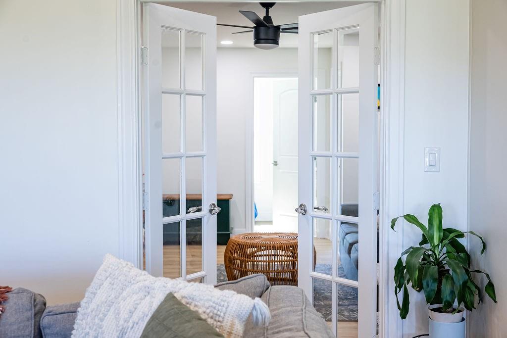 1132 Old Crawford Road Crawford, TX 76638 - Photo 18 of 40 a bedroom with a bed and a potted plant