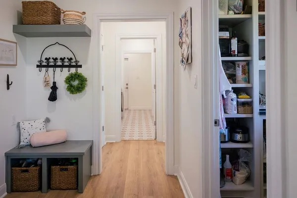 a kitchen with stainless steel appliances a cabinets and a window