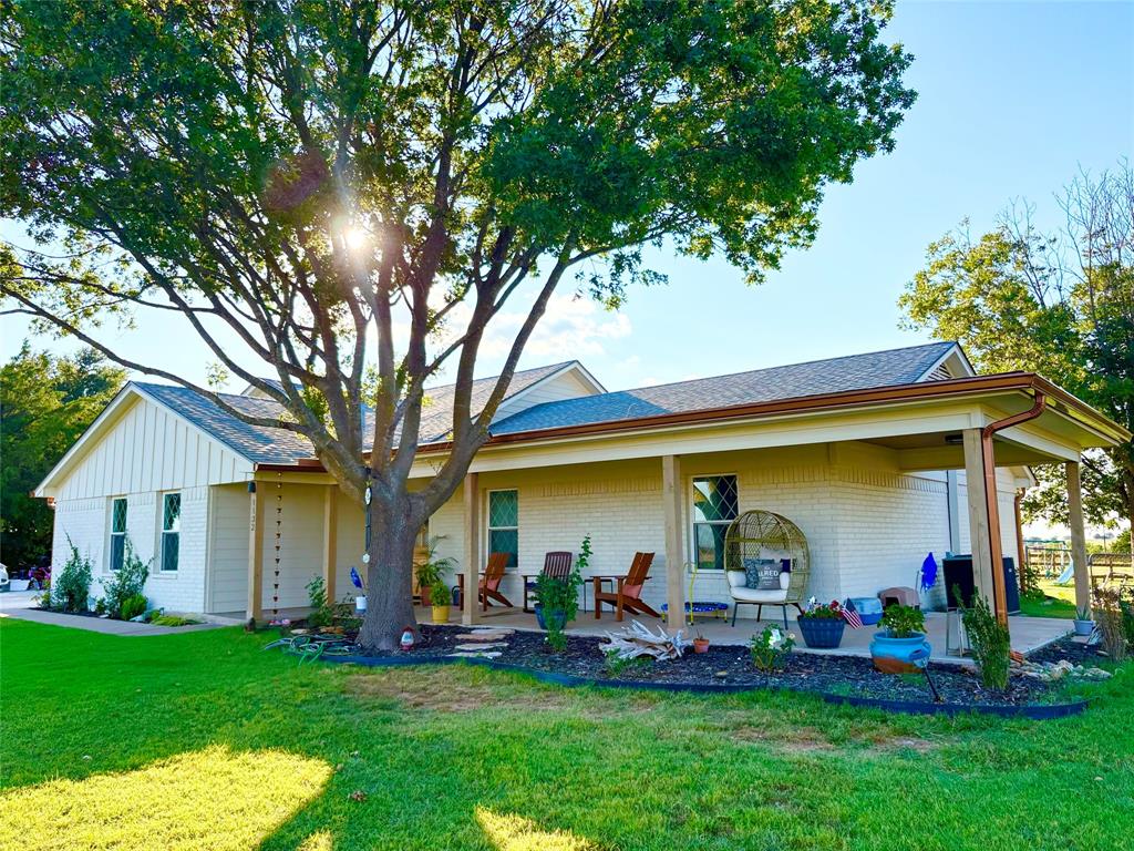 1132 Old Crawford Road Crawford, TX 76638 - Photo 2 of 40 a front view of house with an outdoor seating