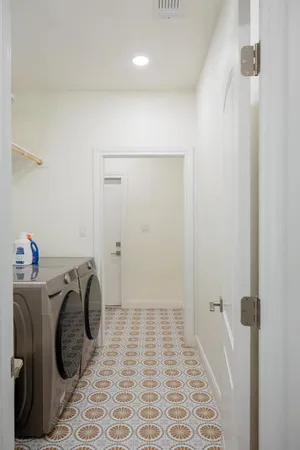 a hallway with a book shelf and a wooden floor