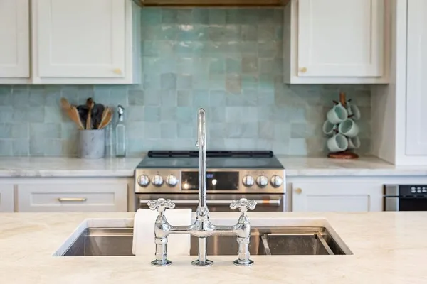 a kitchen with a sink and cabinets