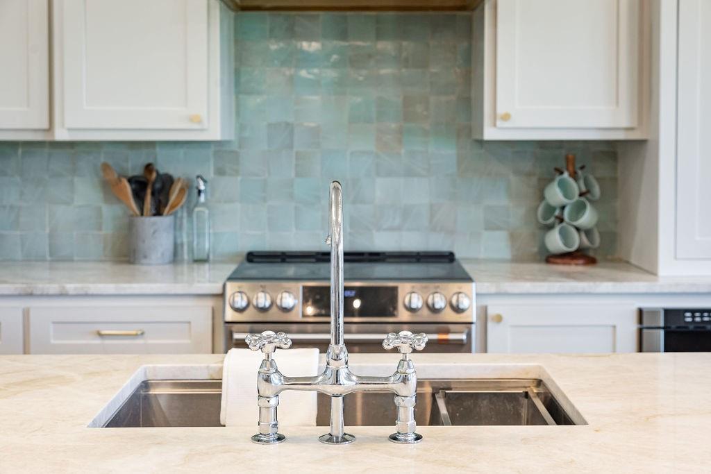 1132 Old Crawford Road Crawford, TX 76638 - Photo 9 of 40 a kitchen with a sink and cabinets