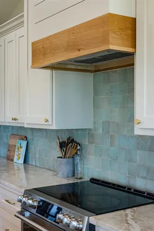 a kitchen with a stove and cabinets