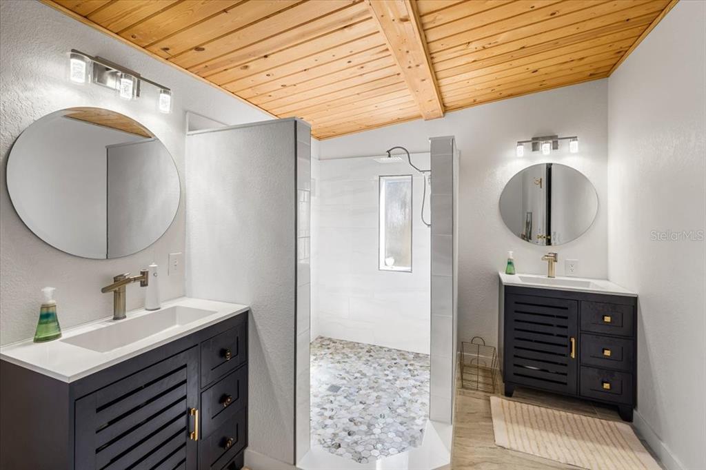 13205 Star Road Brooksville, FL 34613 - Photo 17 of 40 a bathroom with a sink vanity and mirror