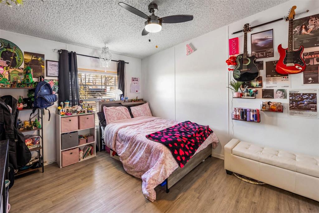 13205 Star Road Brooksville, FL 34613 - Photo 21 of 40 a bedroom with a bed furniture and a window