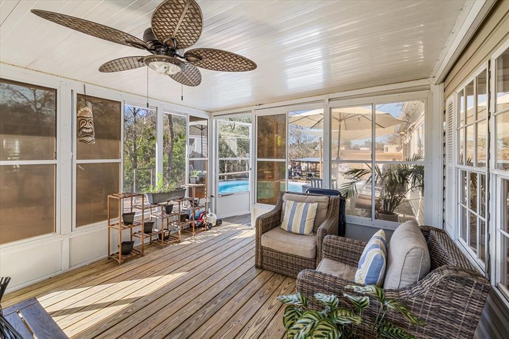 13205 Star Road Brooksville, FL 34613 - Photo 23 of 40 a living room with furniture and a large window