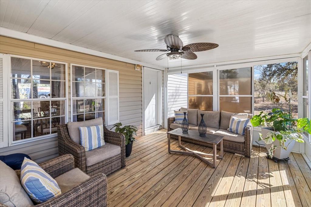 13205 Star Road Brooksville, FL 34613 - Photo 24 of 40 a living room with furniture and a large window