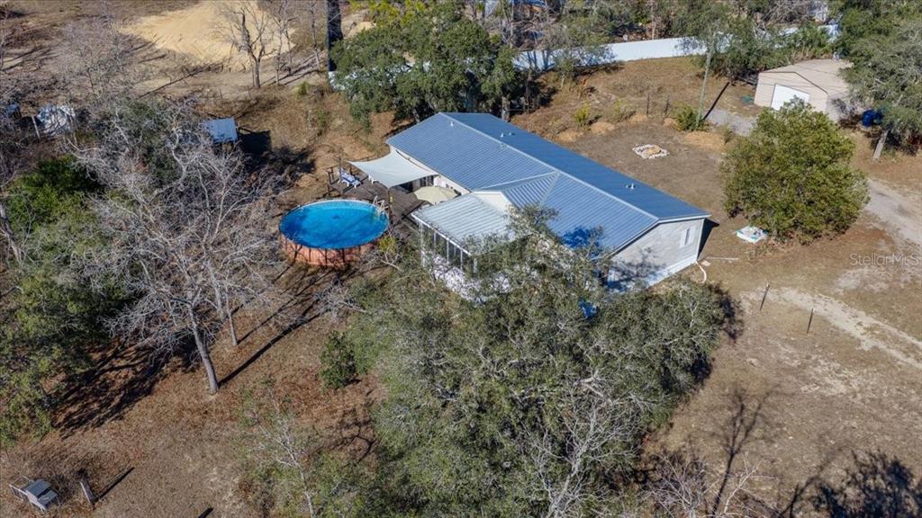 13205 Star Road Brooksville, FL 34613 - Photo 3 of 40 a view of a table and chairs in the patio
