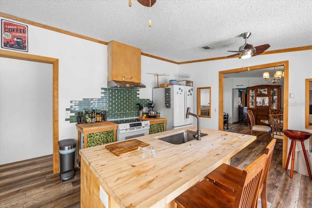 13205 Star Road Brooksville, FL 34613 - Photo 8 of 40 a bed room with a bed and a large mirror