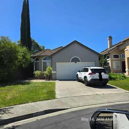 a car parked in front of a house