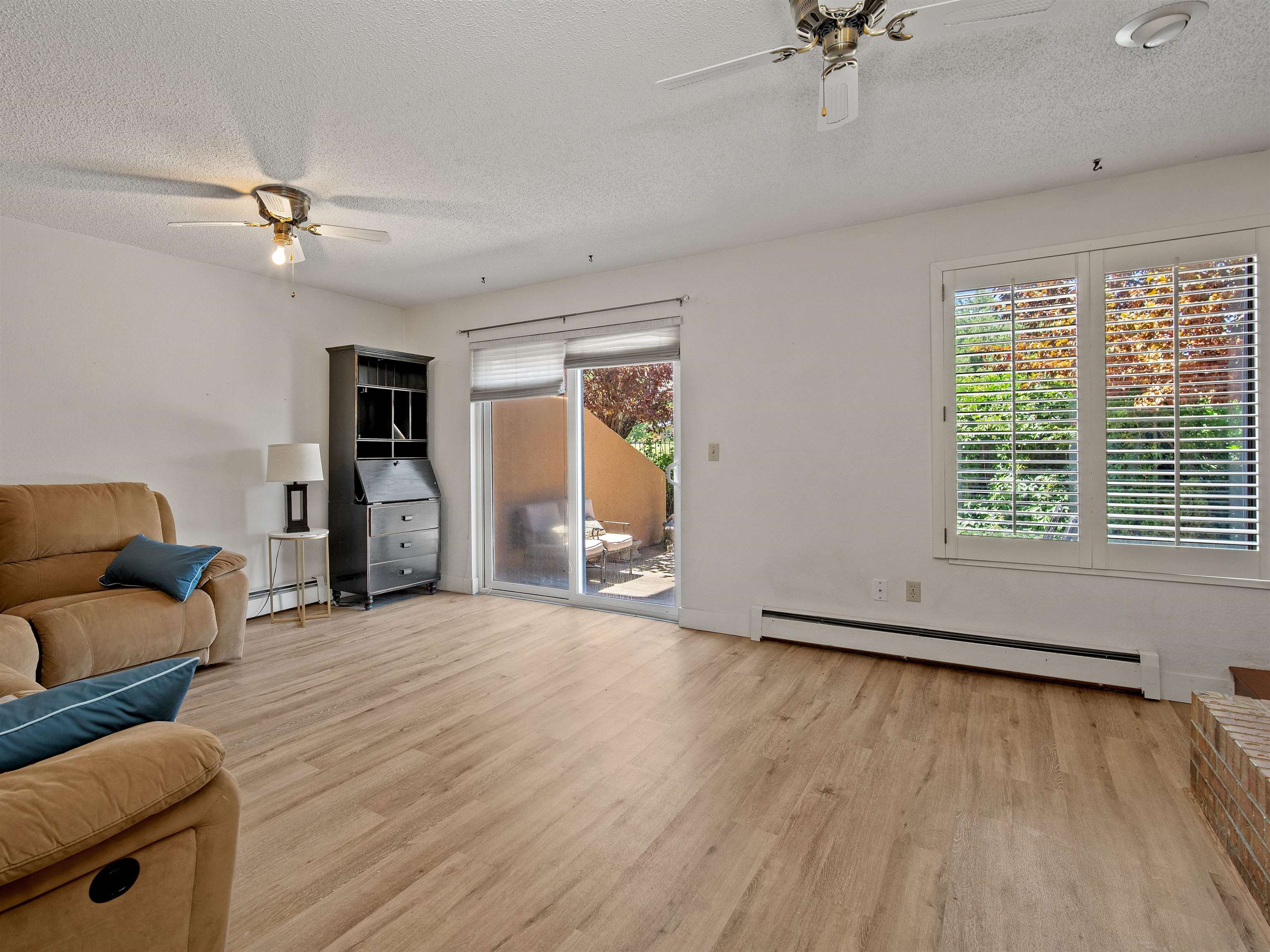 517 Rado Drive, Unit D Grand Junction, CO 81507 - Photo 6 of 24 a view of an empty room with a window and wooden floor