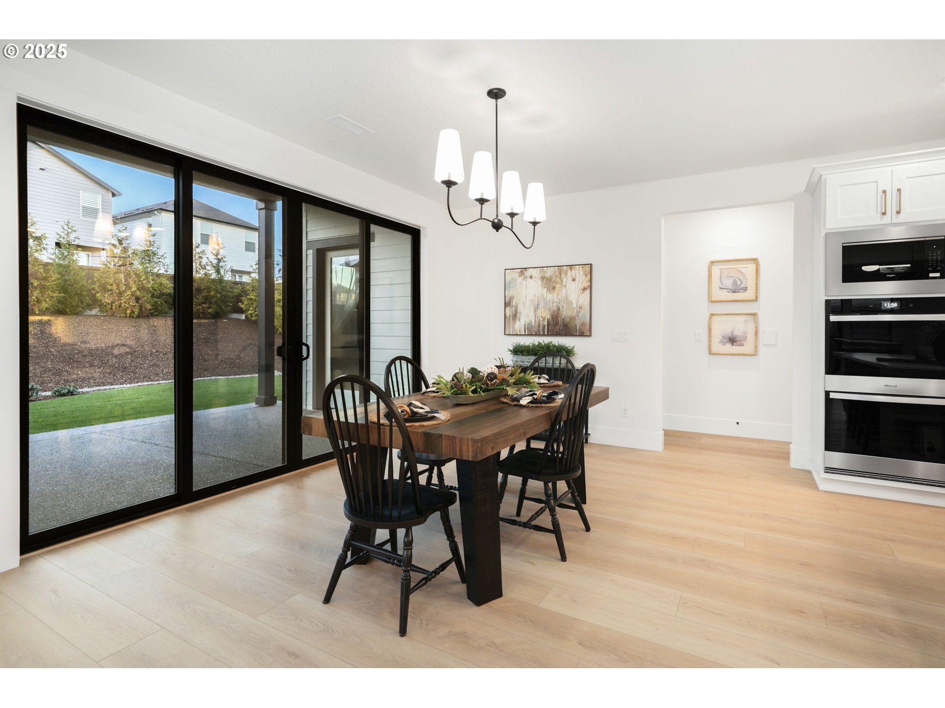 818 Northwest 173rd Street Ridgefield, WA 98642 - Photo 13 of 44 a view of a dining room with furniture window and wooden floor