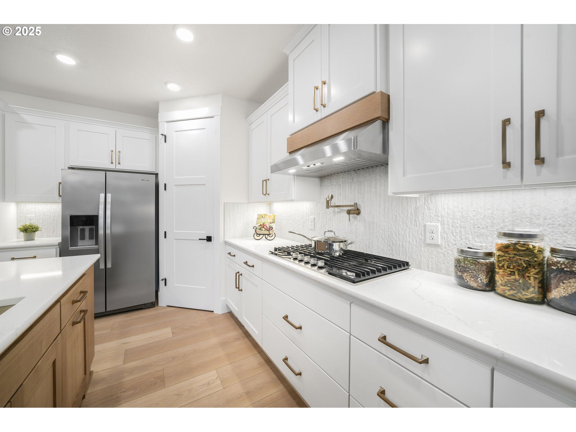 818 Northwest 173rd Street Ridgefield, WA 98642 - Photo 20 of 44 a kitchen with stainless steel appliances granite countertop a sink a stove a refrigerator and cabinets